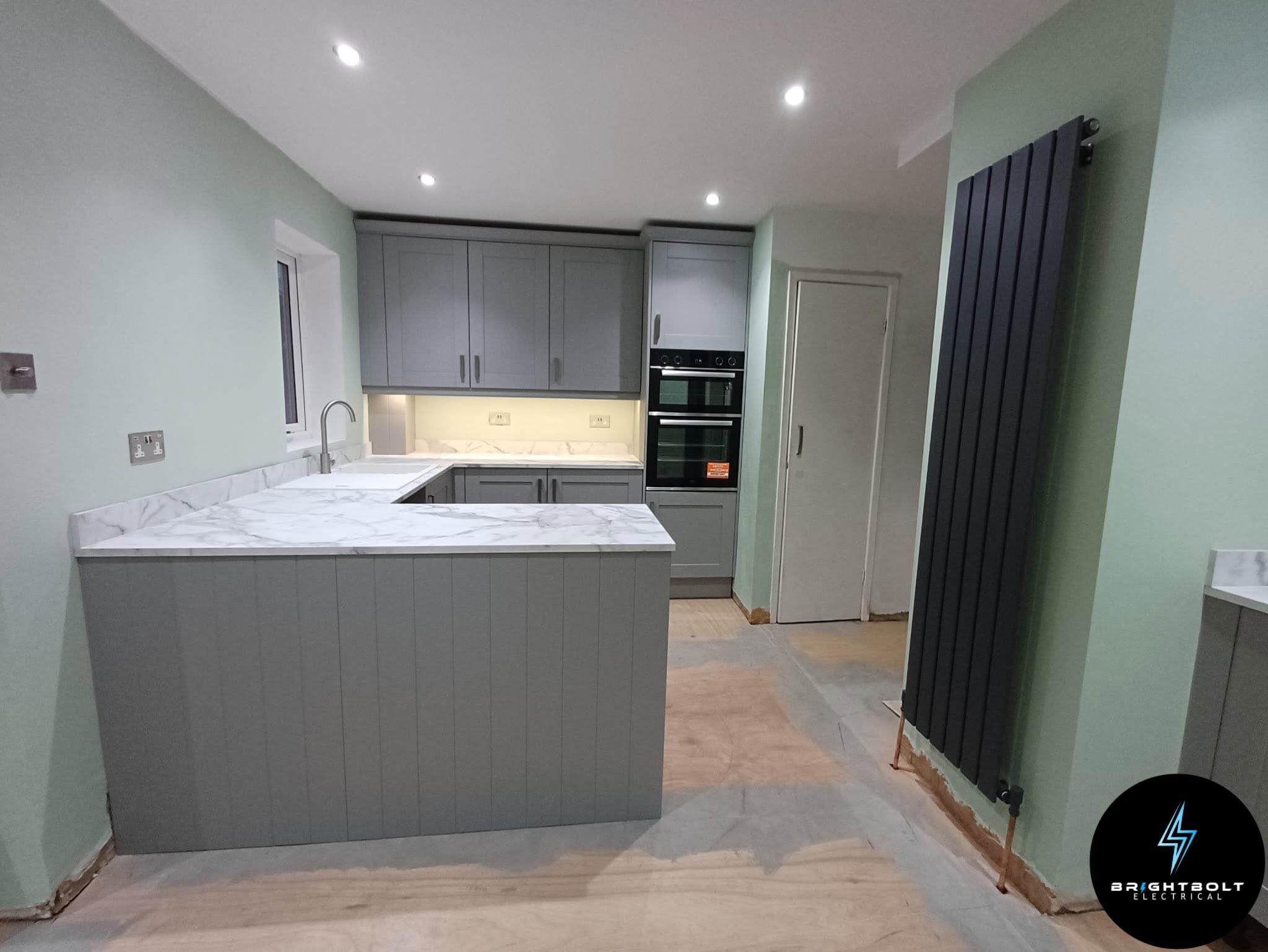 Stroud kitchen with downlights and oven